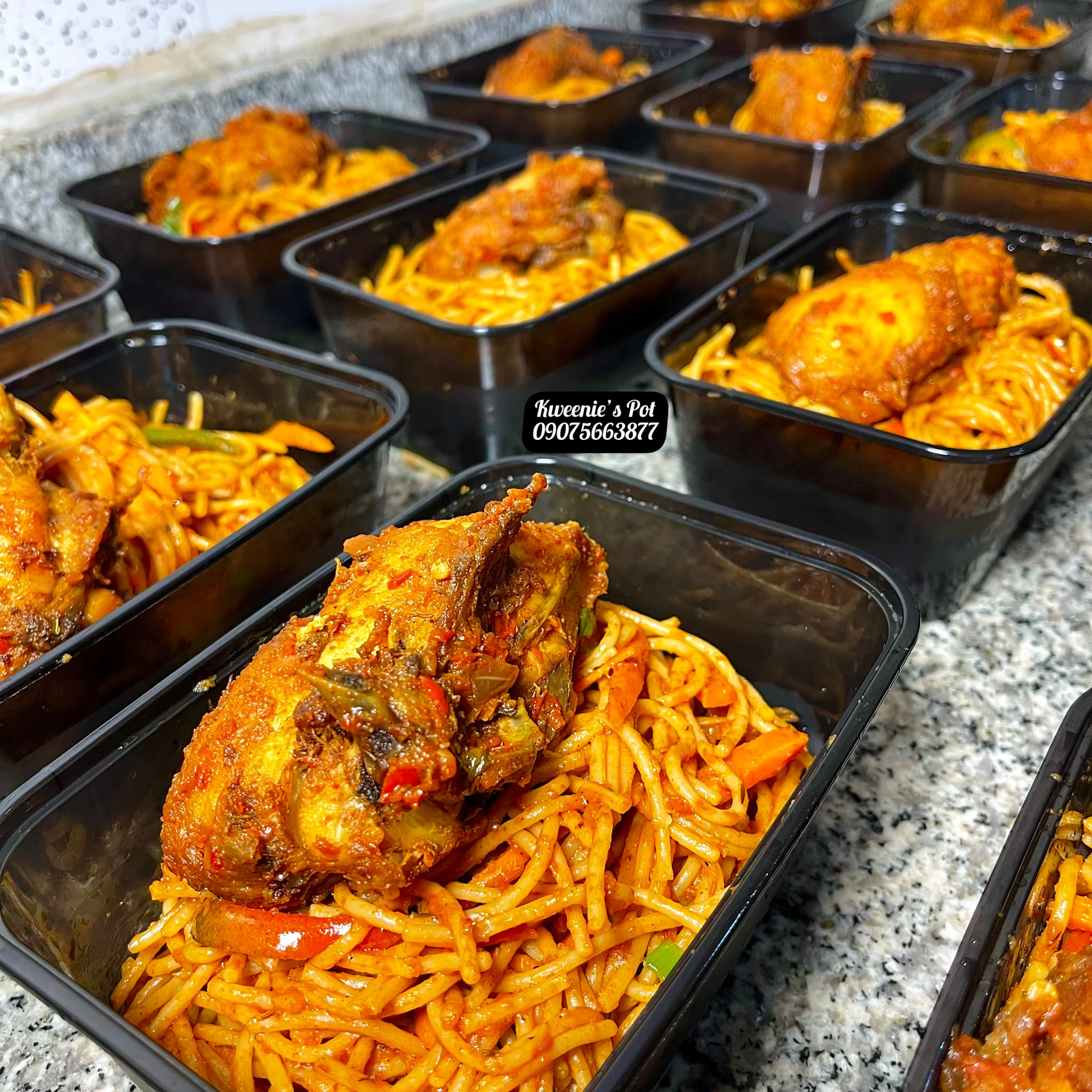 Jollof spaghetti with chicken in delivery containers