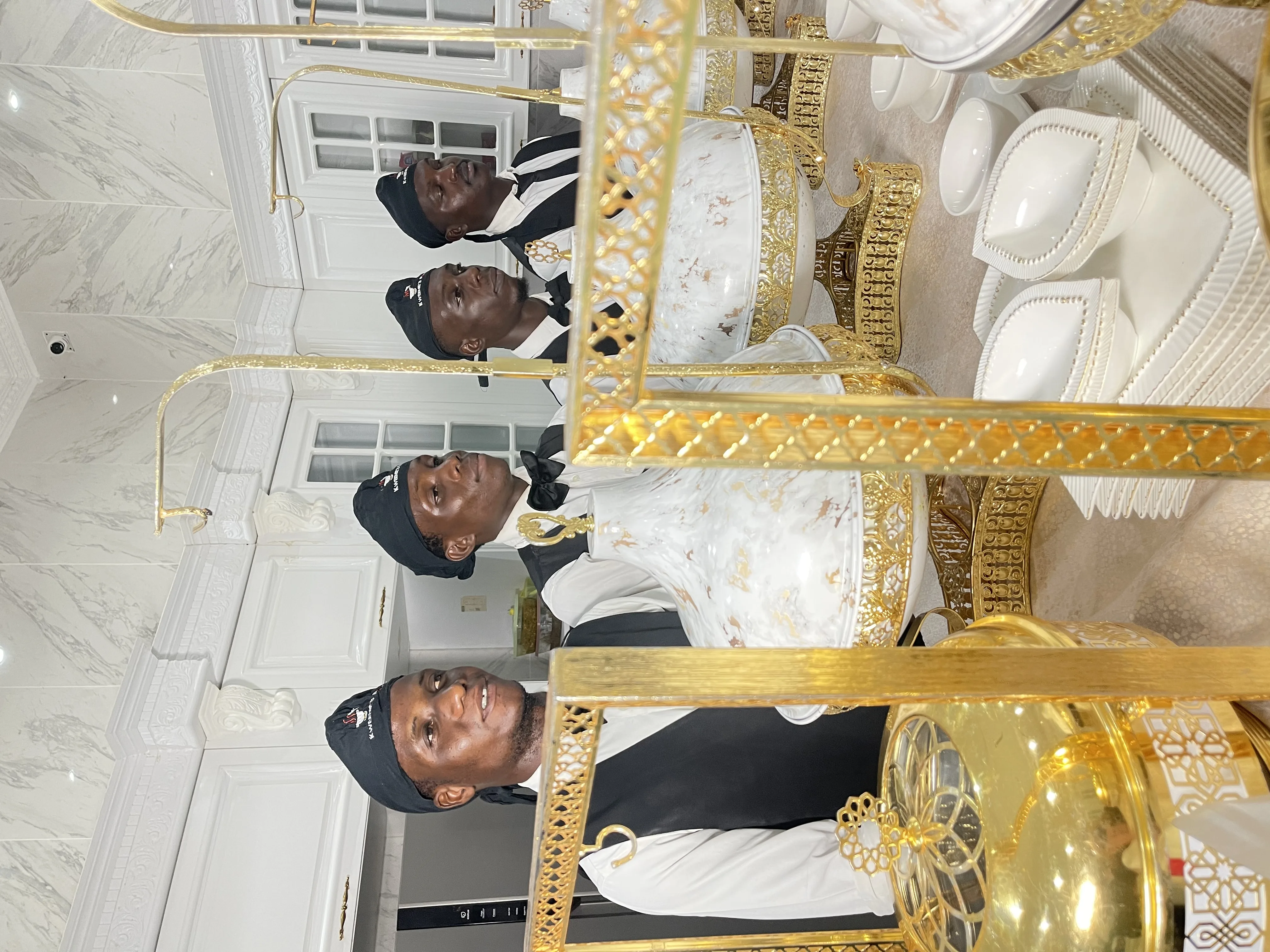 Service team with premium golden catering equipment