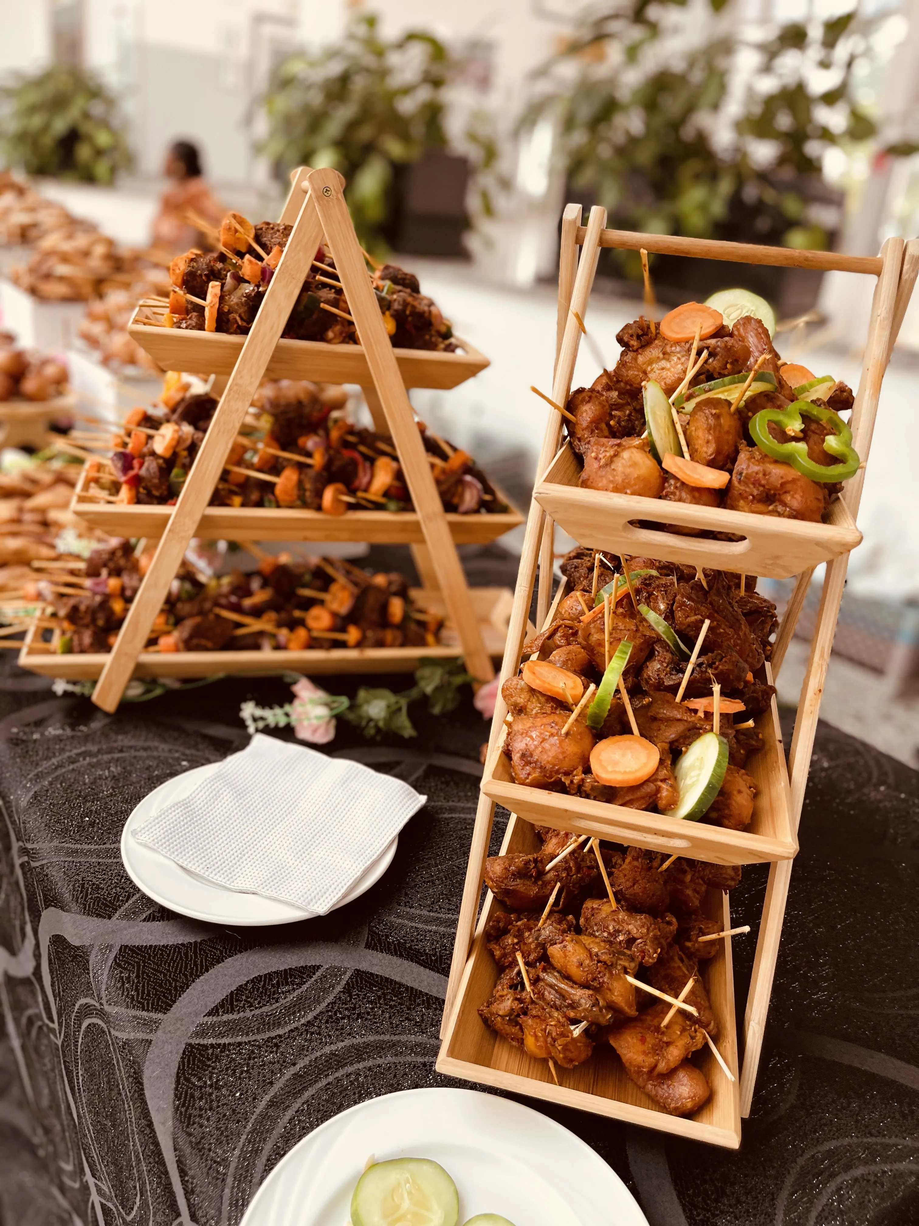 Tiered wooden display with assorted small chops