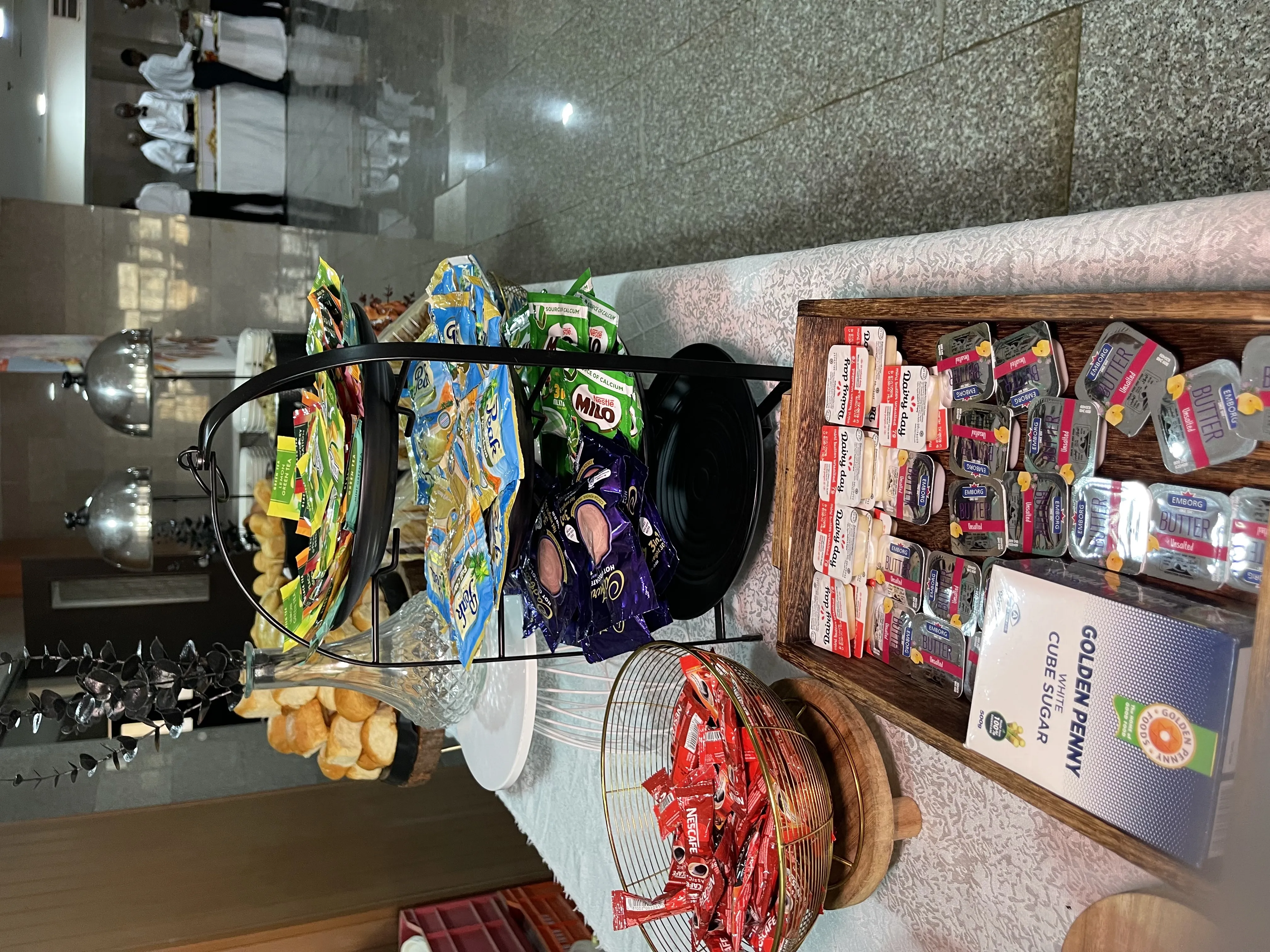 Tea break beverage station with Milo, Nescafe, assorted teas, and sugar cubes